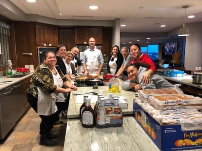 Staff and residents participating in a cooking activity