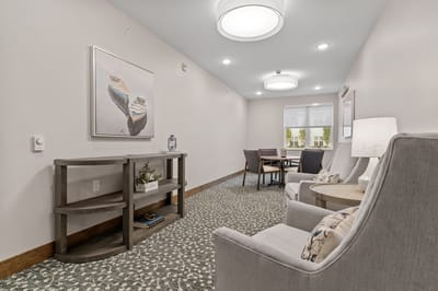 A cozy common area with seating and artwork