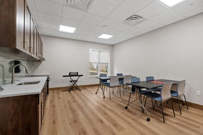 Activity room with tables and chairs