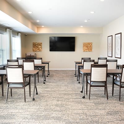 Interior view of a common area with tables and chairs