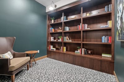 Cozy reading nook with shelves and books