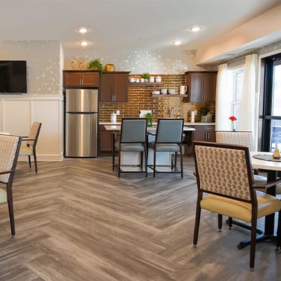 Bright common area featuring kitchen and seating