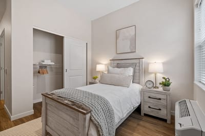 Bright and cozy resident bedroom with warm decor