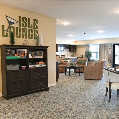 Interior view of a lounge area with seating and games