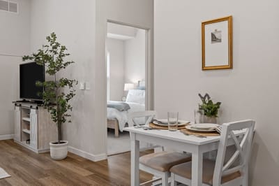 A cozy dining area in a senior living apartment