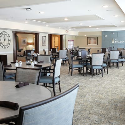 Dining area with tables set for residents