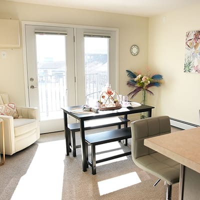 A bright dining area with stylish decor and a table setup