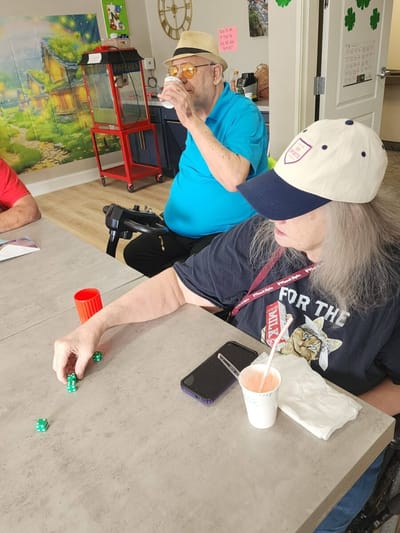 Residents enjoying a game at a table