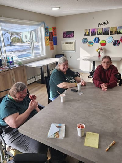 Residents enjoying a snack in a common area