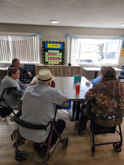 Residents and staff gathered in a common area