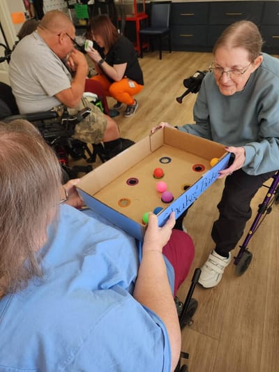 Residents engaging in a game activity together