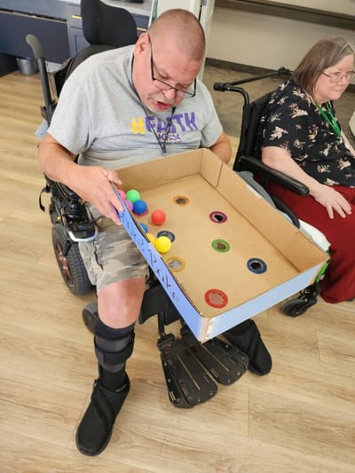 Residents engaging in a colored ball activity