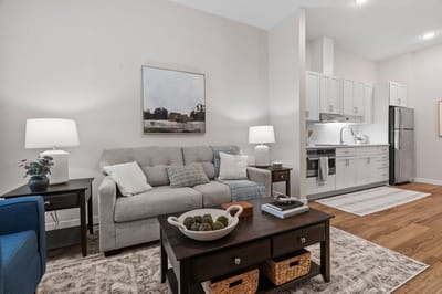 Brightly furnished living room in a senior living unit