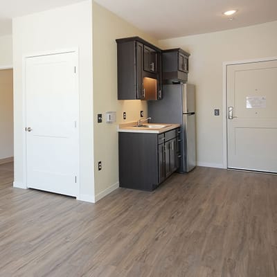 Bright interior of a resident's room with kitchen area