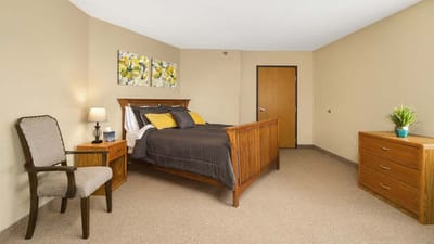 Well-furnished bedroom in a senior living facility