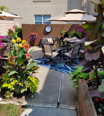 Cozy outdoor seating area with vibrant flowers