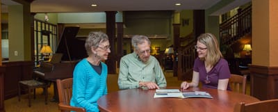 Residents engaged with staff in a common area