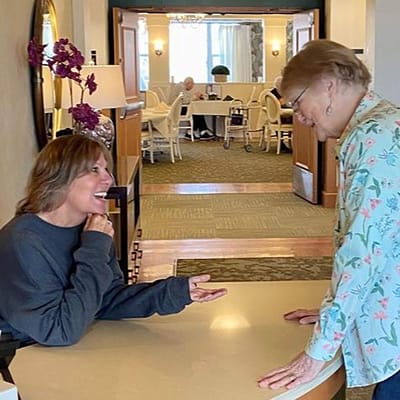 Staff member chatting with a resident in a common area