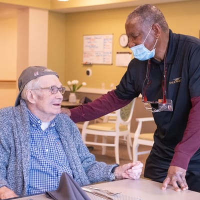 Staff member interacting with a resident in a common area
