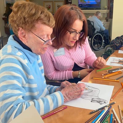 Residents engaging in an art activity together
