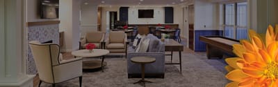 Bright common area with seating and game table
