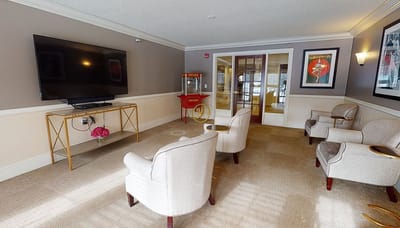 Interior common area with seating and television