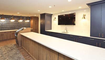 Bright interior view of a modern common area with kitchen