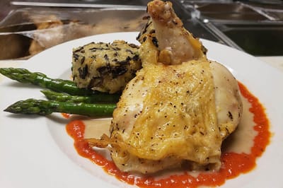 Plate of food with chicken, rice, and vegetables