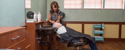 Resident receiving hair treatment in the salon