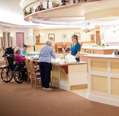 Residents and staff interacting in a common area