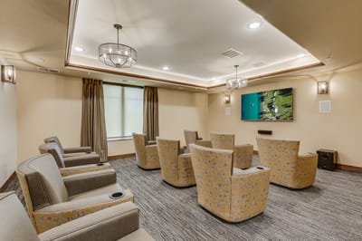 Interior common area with seating and a TV