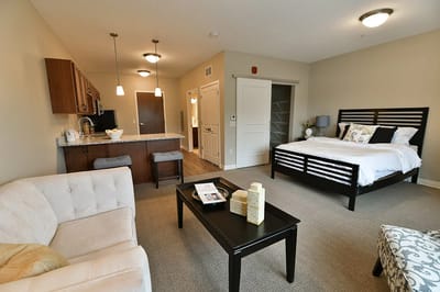 Interior view of a private resident room with seating area