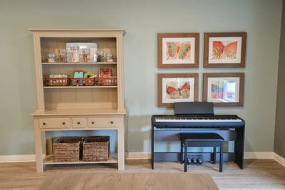Interior decor featuring a piano and artwork