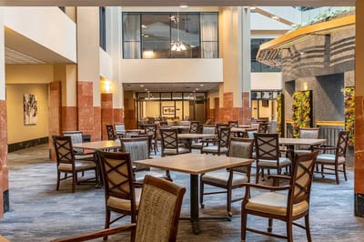 Bright common area with tables and chairs