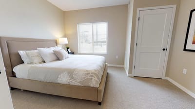 Bright, furnished private resident room with a bed