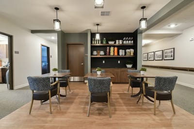 Bright dining area with tables and chairs