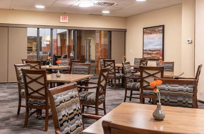 Interior view of a dining area with tables and chairs