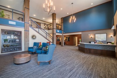 Bright lobby area with seating and reception desk