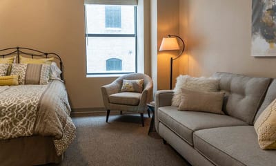 Cozy private room with bed and seating area