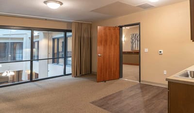 Interior view of a resident room with an open door