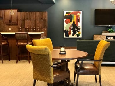 Bright common area with seating and artwork