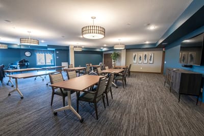 Bright common area with tables and chairs