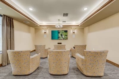 Common area with seating and large screen