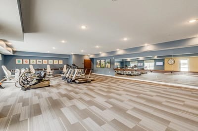 Well-equipped fitness room with exercise machines