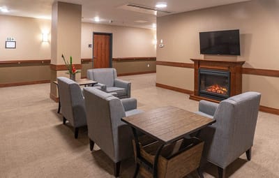 Cozy common area with seating and a fireplace