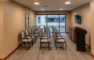 Bright activity room with multiple seating arrangements