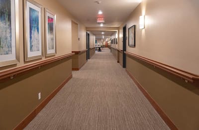 Interior hallway with framed artwork on the walls