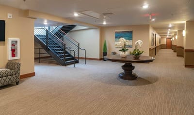 Interior view of a senior living facility hallway and common area