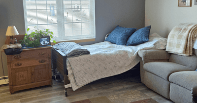 Cozy resident room with bed and seating area
