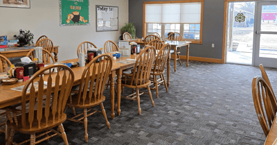 Dining room with wooden tables and chairs
